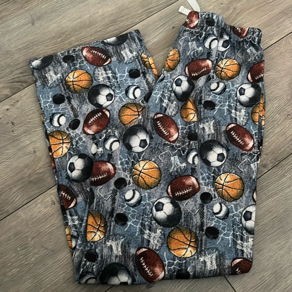 Sports themed pajama pants. Size 10/12